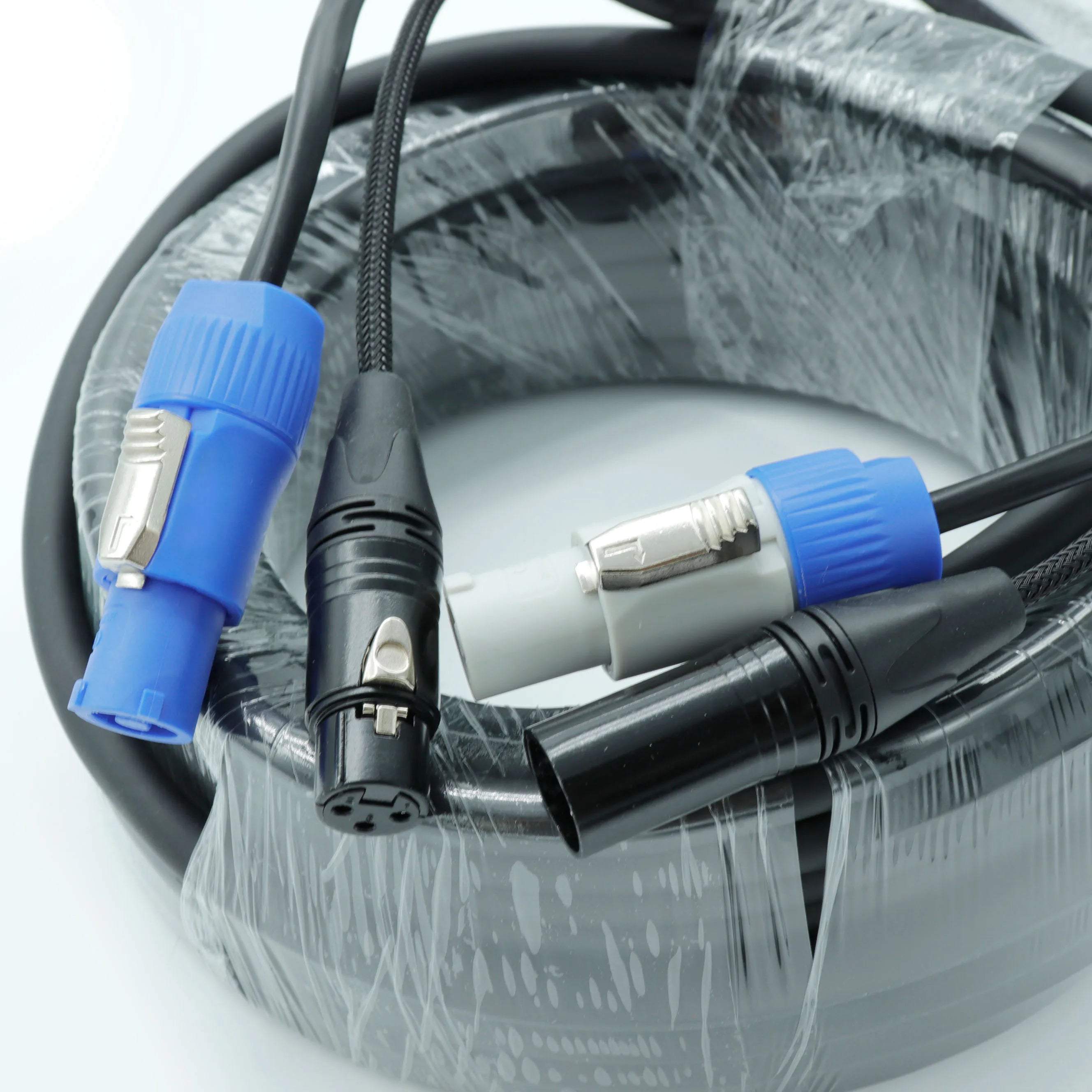 Close-up of a heavy-duty 3-pin XLR to Powercon combo cable with secure connectors, designed for professional stage lighting and audio systems. side view