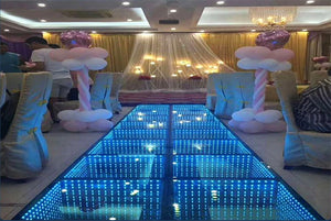 LED dance floor in use at a wedding celebration with dancing guests
