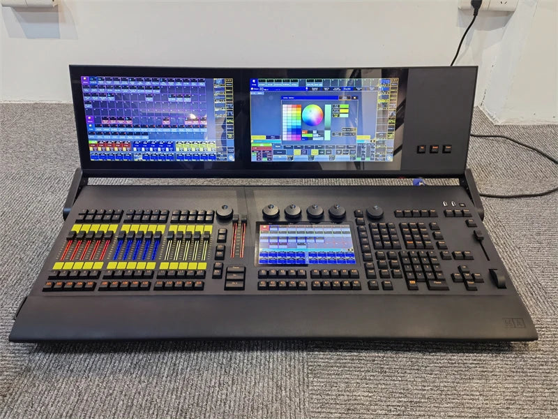 Professional DMX lighting controller with triple touchscreen interface and backlit faders